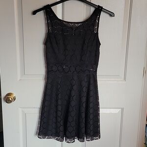Women's/juniors black dress, size 7. Haltertop sleeves.